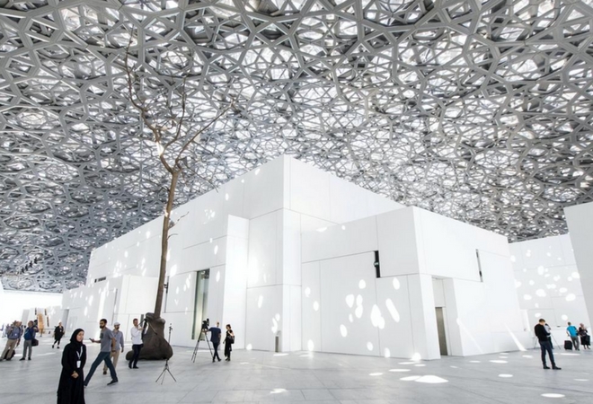 A wide view of the interior of the Louvre Abu Dhabi with a silver-toned dome ceiling. | Image credit and source: Christopher Pike / The National