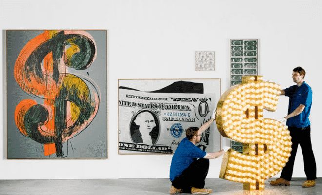 A-collection-of-21-artworks-that-celebrate-the-power-and-symbolism-of-the-US-dollar-went-on-sale-at-Sothebys-on-1-July-2015-—-including-Tim-Noble-and-Sue-Webster’s-sculpture-“”-2001.-660x400