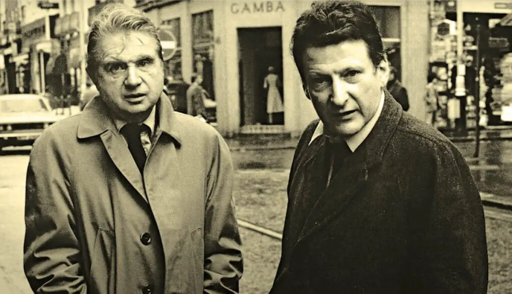 Freud and Bacon standing side by side on the street.
